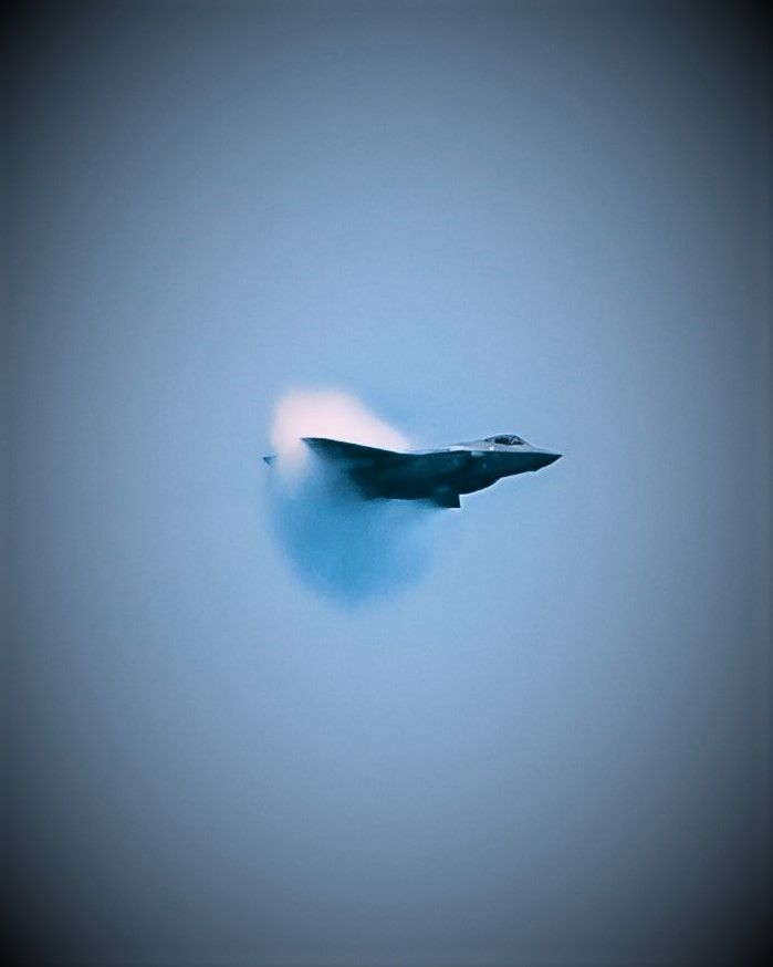 Sonic boom with a shock wave behind an airplane